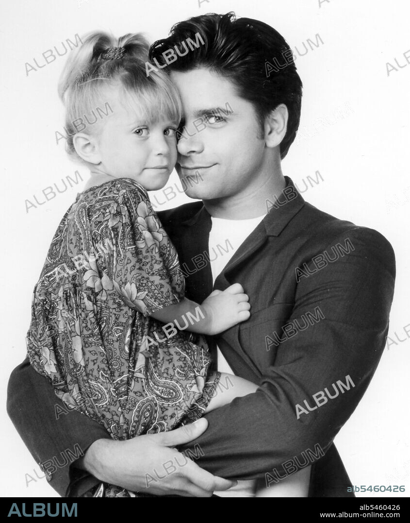ASHLEY OLSEN, JOHN STAMOS and MARY-KATE OLSEN in FULL HOUSE, 1987, directed by JEFF FRANKLIN. Copyright LORIMAR PRODUCTIONS.
