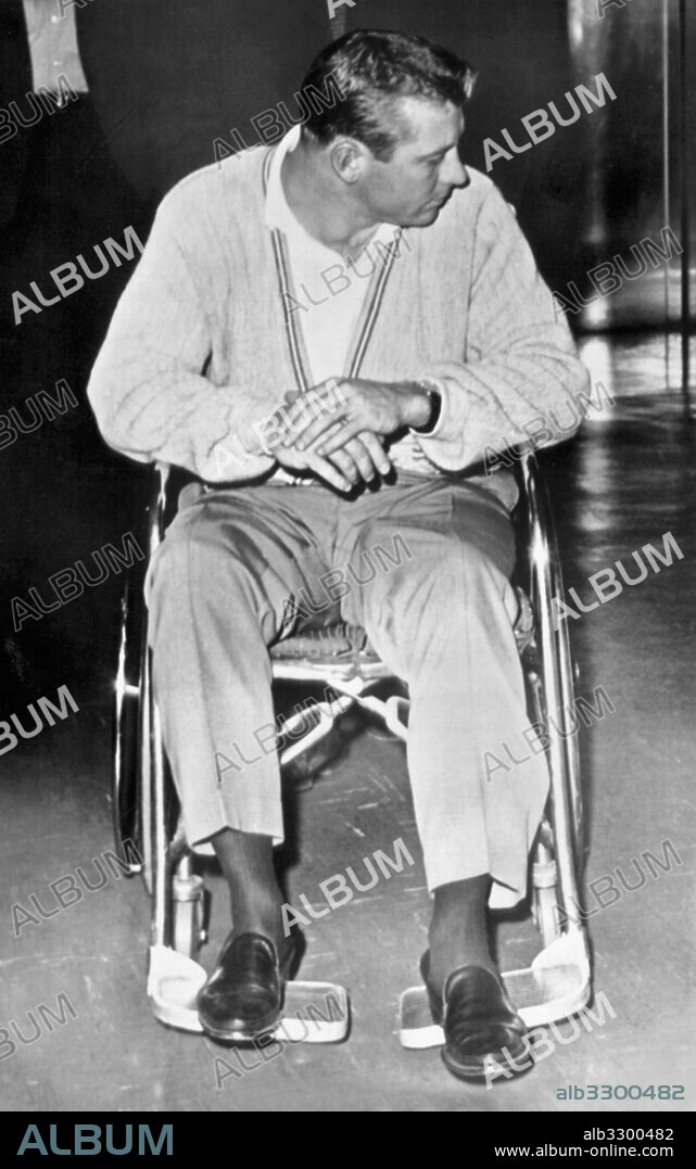 New York, New York:  May 19, 1962.New York Yankee baseball star Mickey Mantle in a wheelchair at Lenox Hil Hospital after tearing a thigh muscle while running out a groundball in the 9th inning in a game against the MInnesota Twins. The Twins won, 4-3.