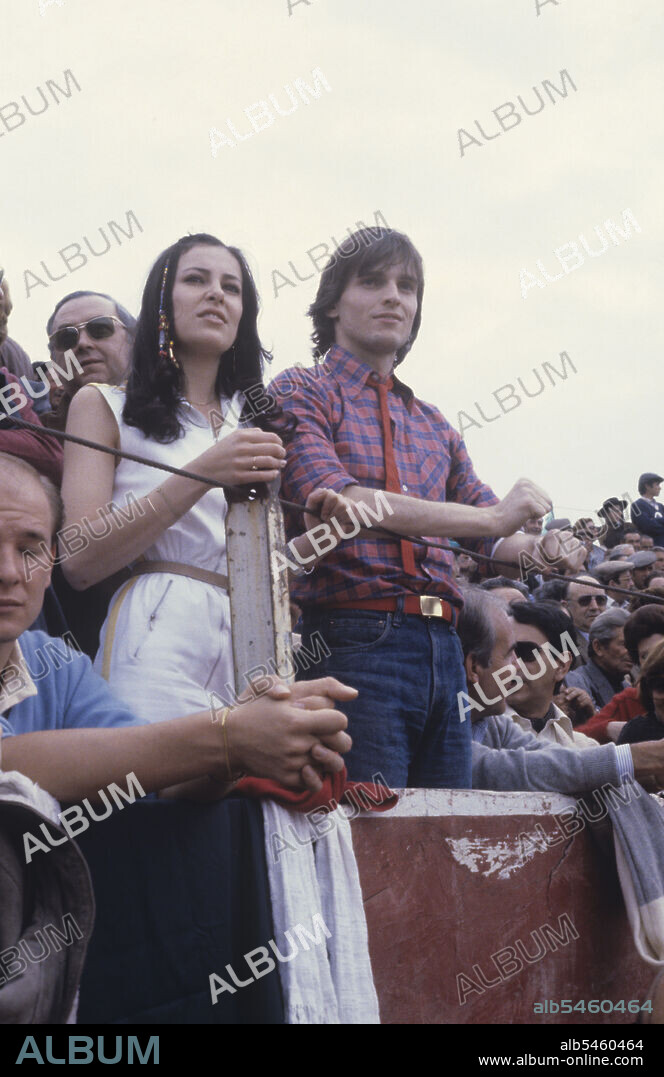 MIGUEL BOSE and ANA OBREGON. Spanish-born Italian singer and TV presenter Miguel BosÃ© attending a bullfight in the surroudings of Madrid with Spanish actress and TV presenter Ana Obregon (Ana Victoria Obregon). Spain, 1980 (Credit Image: © Angelo Deligio/Mondadori Portfolio via ZUMA Press).