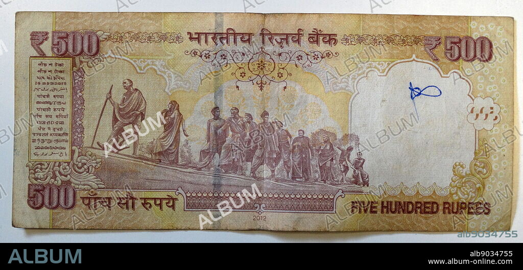 Reverse of the 500 Rupee banknote, used in India, between October 1997 and November 2016. Depiction shows the Salt March, also known as the Dandi March and the Dandi Satyagraha, was an act of nonviolent civil disobedience in colonial India led by Mohandas Karamchand Gandhi to produce salt from the seawater in the coastal village of Dandi in 1930. It was a direct action campaign of tax resistance and nonviolent protest against the British salt monopoly.