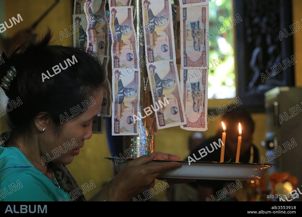Buddhist money tree to make merit and donate to local temple. Wat Simuong. Wat Si Muang. Vientiane, Laos.