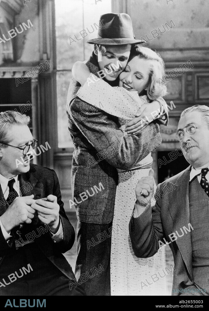 EDWARD ARNOLD, JAMES STEWART, JEAN ARTHUR et LIONEL BARRYMORE dans YOU CAN'T TAKE IT WITH YOU, 1938, réalisé par FRANK CAPRA. Copyright COLUMBIA PICTURES.