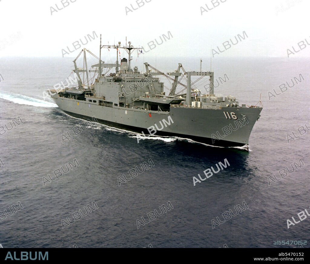 1976 - An aerial starboard bow view of the amphibious cargo ship USS ST. LOUIS (LKA-116) underway off the Southern California coast.