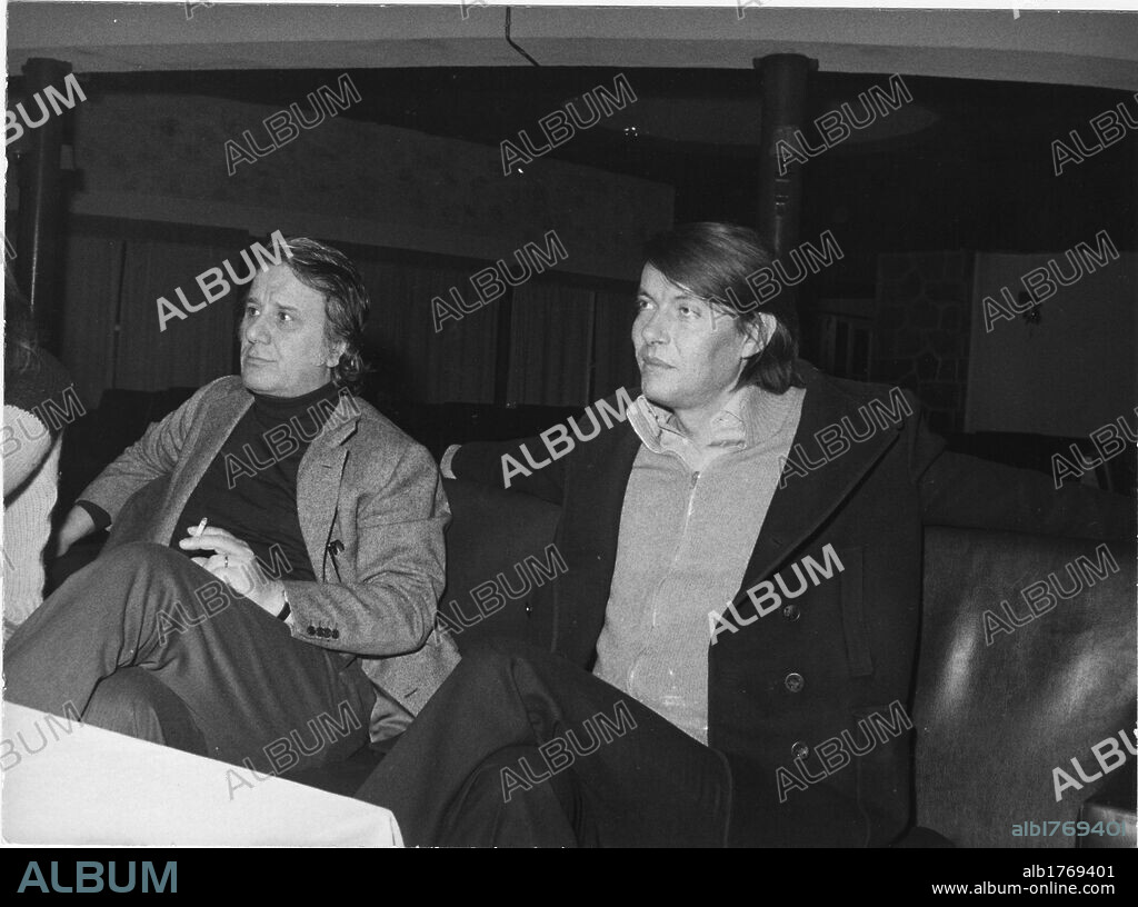 Fabrizio De Andre with Sergio Bernardini. The Italian singer-songwriter Fabrizio De Andre sitting next to Sergio Bernardini, owner of the 'La Bussola' nightclub. Viareggio, 1974.