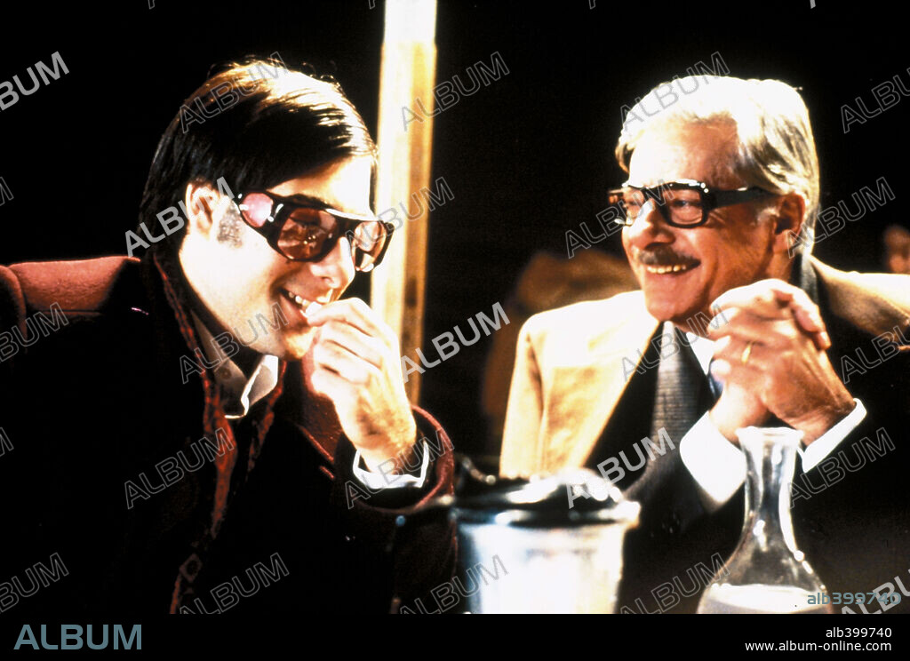 GIANCARLO GIANNINI and JASON SCHWARTZMAN in CQ, 2001, directed by ROMAN COPPOLA. Copyright MYRIAD PICTURES.