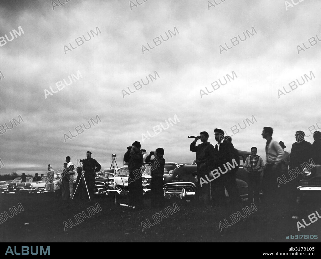 Worcester, Massachusetts:  October 2, 1959 People watching a total eclipse of the sun that reached totality at sunrise in the Boston area.   © Underwood Archives / The Image Works.