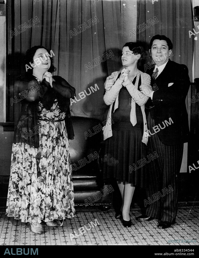 Left: Madame Paliughi (left) heard Miss Nora Hill (Gilda) and Primo Montanari (the Duke) rehearsing for tomorrow's Opera-matinee, "Rigoletto." May 23, 1932.