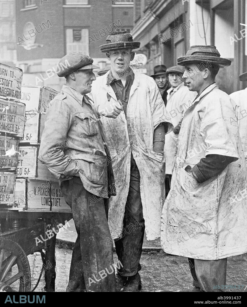 Market porters at Billingsgate, City of London, 1954. Porters with their trademark hats at the famous fish market.
