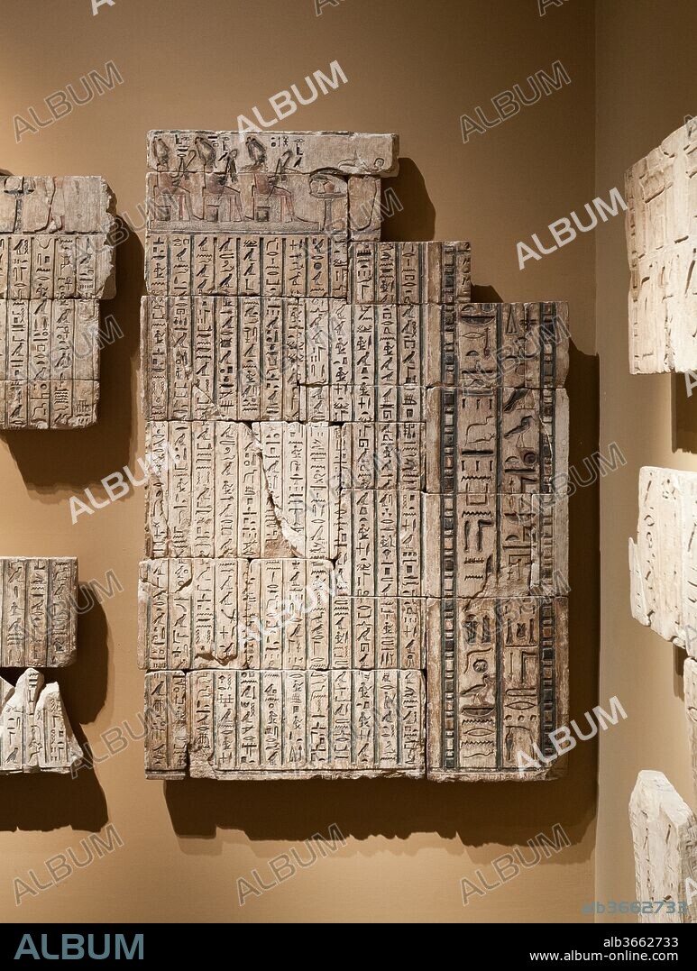 Relief from the tomb of Bakenrenef, wall from small room with texts and niches. Dynasty: Dynasty 26. Reign: reign of Psamtik I. Date: 664-610 B.C..
Between the innermost room (see 11.150.5a) and the pillared hall (see 11.150.5b*) was a smaller room whose walls were covered 
with lists of offerings and magical texts, interrupted by four small niches. These two wall sections (see also 11.150.50d*) formed the southwest corner of this chamber. On the outer edge of each section is part of the frame of a niche. At the top, Bakenrenef is shown worshiping various aspects of Osiris, each represented as a seated figure of the god.
For Curatorial Interpretation of this group of reliefs, see 11.150.50a-d-related.