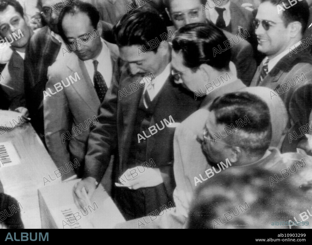 Miguel Aleman, candidate of the government controlled PRI party votes for president to Mexico's first federally controlled general election today as partisans today look on. July 31, 1946. (Photo by Associated Press Wirephoto).
