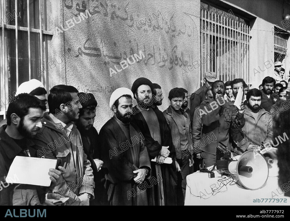 Iran-Iraq War (22.09.1980- 20.08.1988) / Exile Mohammad Baqir al-Hakim. The leader of the Iraqi Shiite opposition to Saddam Hussein and head of the Supreme Council for the Islamic Revolution in Iraq, Mohammad Baqir al-Hakim, has spent more than 20 years in exile in Iran since 1979. At the time of the Iran-Iraq war, he supported the Shiites in the revolt in southern Iraq. Ayatollah Mohammad Baqir al-Hakim (in the middle, with the black turban looking at the photographer) in an Iraqi prison camp in Iran. Photo, 28.02.1983.