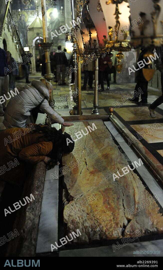 Israel. Jerusalem. Church of the Holy Sepulchre. Stone of the Anointing or Unction, where Nicodemus and Joseph of Arimathea prepared the body of Jesus for burial. Old City.