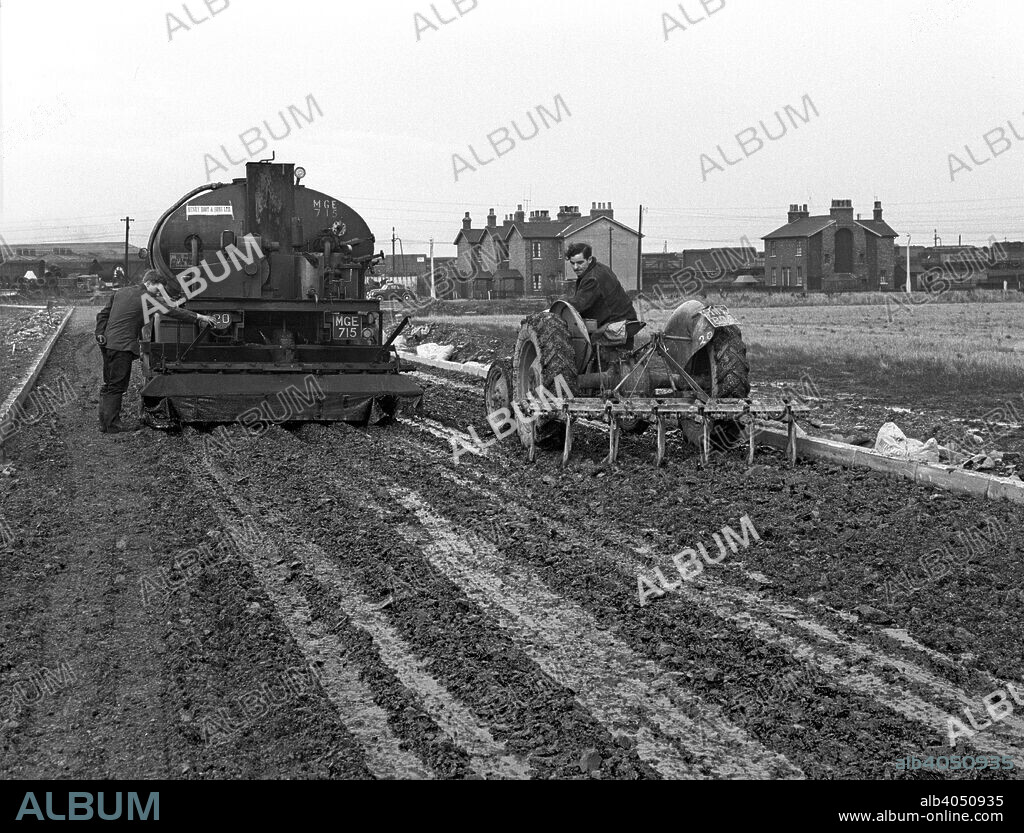 Road construction work, Doncaster, South Yorkshire, November 1955. Workers from Henry Boot & Sons at work on the construction of a new factory roadway. It is believed the photograph was taken in front of the British Ropes (now Bridon Wire) factory on Carr Hill.
