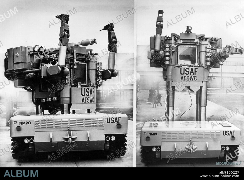 85 ton robot will handle radioactive materials. This 85 ton robot named Beetle is being tested for work in 'hot' nuclear areas by the US Atomic Energy Commission and the Air Force in the State of Nevada. The operator, protected by thick lead and glass shields turns his cab left and raises it 25 feet above the ground. The mechanical arms can carry parts and perform intricate operations on nuclear power and propulsion systems.
