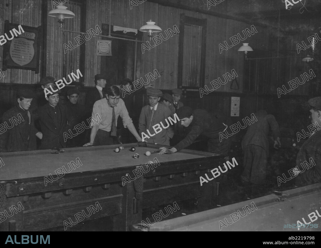 Elm Pool Room (inside): Nathan Sher, 69 Walden St. William Donovan, Elm Pool Room. George, 28 Elm St. (youngest pin boy). Bill Simmons (manager). Frank Worcester, 28 Elm St. Alton Tripp, 31 High St. Theodore Lewis, Elm Pool Room. Donnie Murray, Elm Pool Room. Joe Correia, 36 Elm St. Location: New Bedford, Massachusetts.
