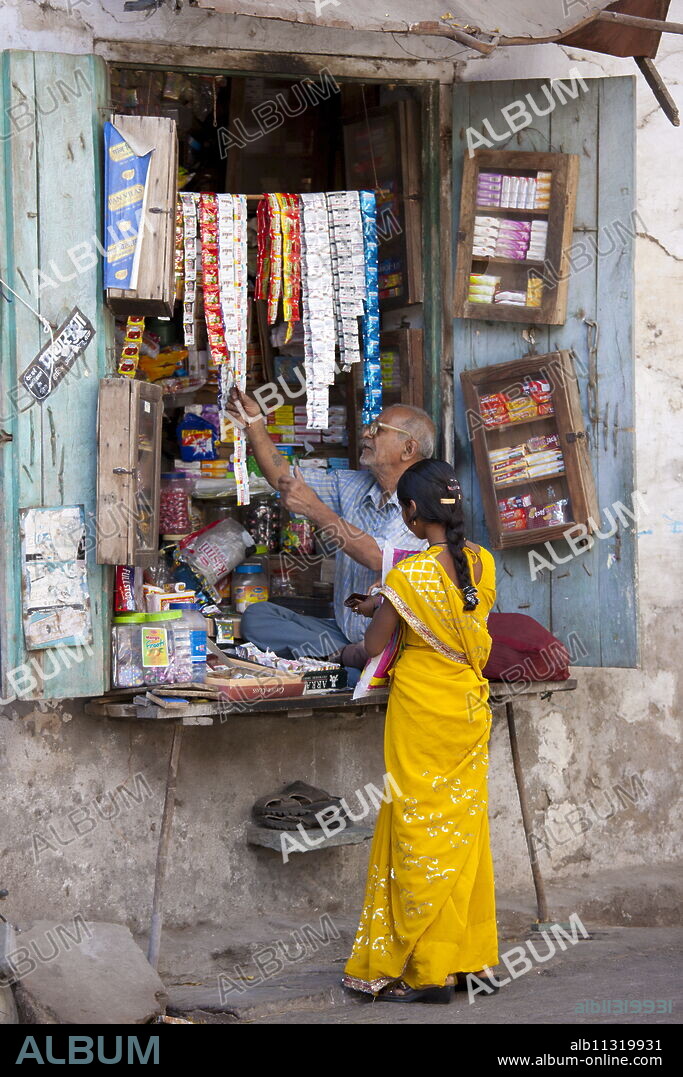 Young Indian woman out shopping in old town Udaipur, Rajasthan, Western India.