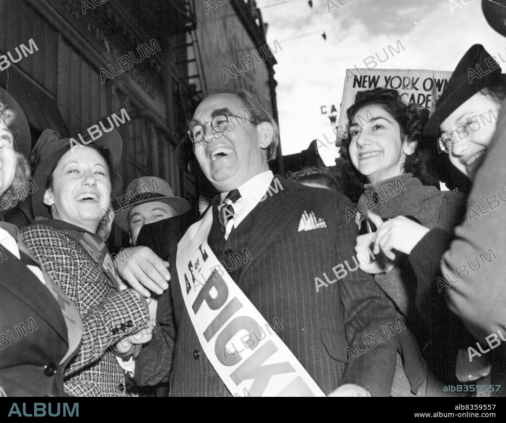 Tom Mooney Takes a Turn on the Picket Line - Tom Mooney, 56-year-old former labor leader, who was pardoned by the Governor Jan. 7, and obsolved of guilt in the 1916 San Francisco Preparedness Day bombing which killed ten persons, is seen as he was mobbed by pretty strikers at a national chain store here as he made an appearance on their picket line recently. January 11, 1939. (Photo by Wide World Photo).