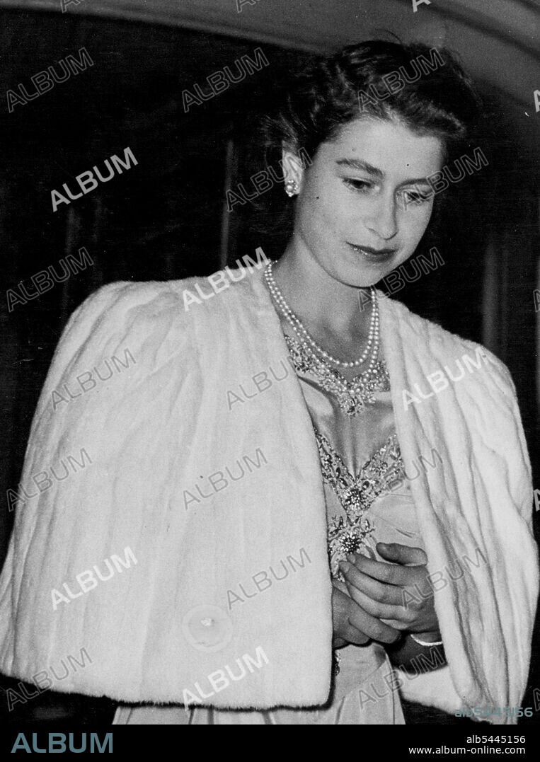 Princess Elizabeth And Lieutenant Philip Mountbatten To Wed; The Princess Attends Private Dinner Party at Dorchester Hotel. Princess Elizabeth - with folded hands - leaving the Dorchester Hotel after the dinner party. After the announcement of the engagement of Princess Elizabeth to Lieutenant Philip Mountbatten (formerly Prince Prince Philip of Greece) the Princess went to the Dorchester Hotel, in London, for a private dinner party - and later the party went to Apsley House, for dancing. July 9, 1947.
