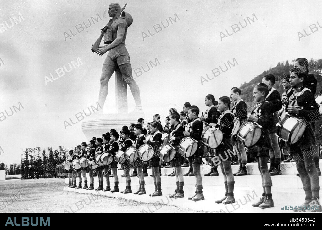 Mussolini Opens New Ballila Academy of MusicYoung Drummers of the new academy, lined up at the memorial, during the ceremony in Rome.On the occasion of the opening of the new Music Academy for Young Fascistal Signor Mussolini unveiled a huge statue of a Ballila (Young Fascist), carrying rifle and gas mask. April 07, 1936. (Photo by Keystone).