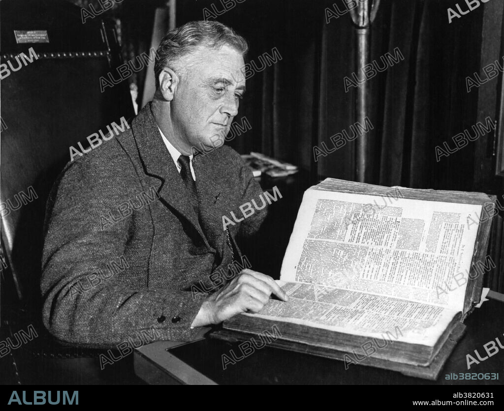 FDR with family bible, Hyde Park, February 22, 1933. Franklin Delano Roosevelt (January 30, 1882 - April 12, 1945) was the 32nd President of the US (1933-45) and a central figure in world events during the mid-20th century, leading the US during a time of worldwide economic crisis and world war. The only American president elected to more than two terms, he facilitated a durable coalition that realigned American politics for decades. With the popular song "Happy Days Are Here Again" as his campaign theme, FDR defeated incumbent Republican Hoover in 1932, at the depth of the Great Depression. FDR's persistent optimism and activism contributed to a renewal of the national spirit, reflecting his victory over paralytic illness to become the longest serving president in US history. As an active military leader, he implemented a war strategy on two fronts that ended in the defeat of the Axis Powers, and he initiated the development of the world's first atomic bomb. He worked closely with Churchill, Stalin and Kai-shek in leading the Allies against Nazi Germany, Fascist Italy and Imperial Japan in WWII, but died just as victory was in sight. On April 12, 1945 he suffered a massive cerebral hemorrhage and died at the age of 63. His death was met with shock and grief across America and around the world.