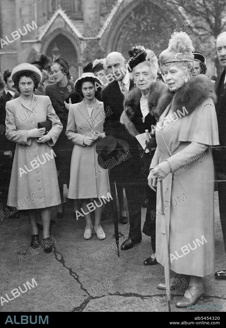 Princesses ***** Wedding : Princess Elizabeth, Princess Margaret Rose and Queen Mary attended the wedding of Miss Myra Wernher, younger daughter of Sir Harold and Lady Wernher to Major David Butter, Scots guards at St Margaret's, Westminster, London, today November 5. The bride wore a gown of pre-war silver lace over delicate pink modelled in Russian style and appliqued under ***** with flowers. Her train, cut in one ***** net bordered with *****. Right: Princess Elizabeth, Princess Margaret Rose, the Earl of Athlone, the Dowager Duchess of Milford Haven, and Queen Mary watching the bridal procession leave St. Margaret's Westminster after the wedding of Miss Myra Wernher, and Major David Butter. November 19, 1946. (Photo by Associated Press Photo).