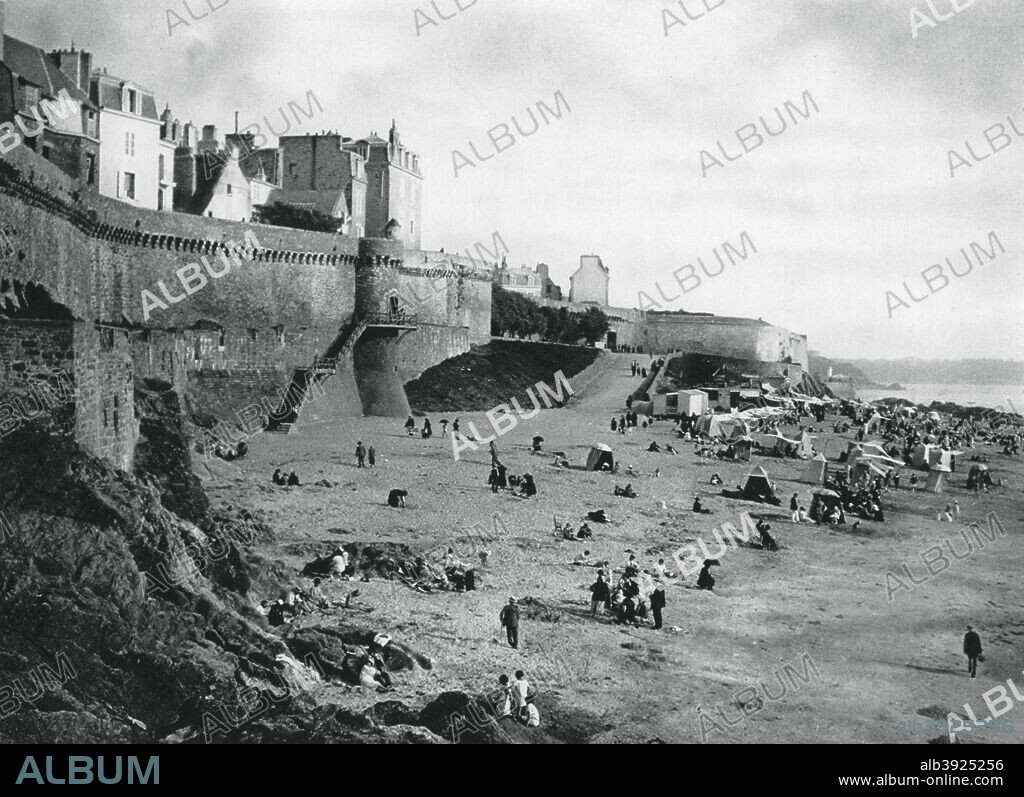 MARTIN HUERLIMANN. Saint-Malo, France, Brittany, 1937. View of the walled port city and beach with tents for changing into bathing costumes. Illustration from Frankreich: Baukunst, Landschaft Und Volksleben, a work on French architecture, landscape and people by Martin Hürlimann, (Berlin, 1937).