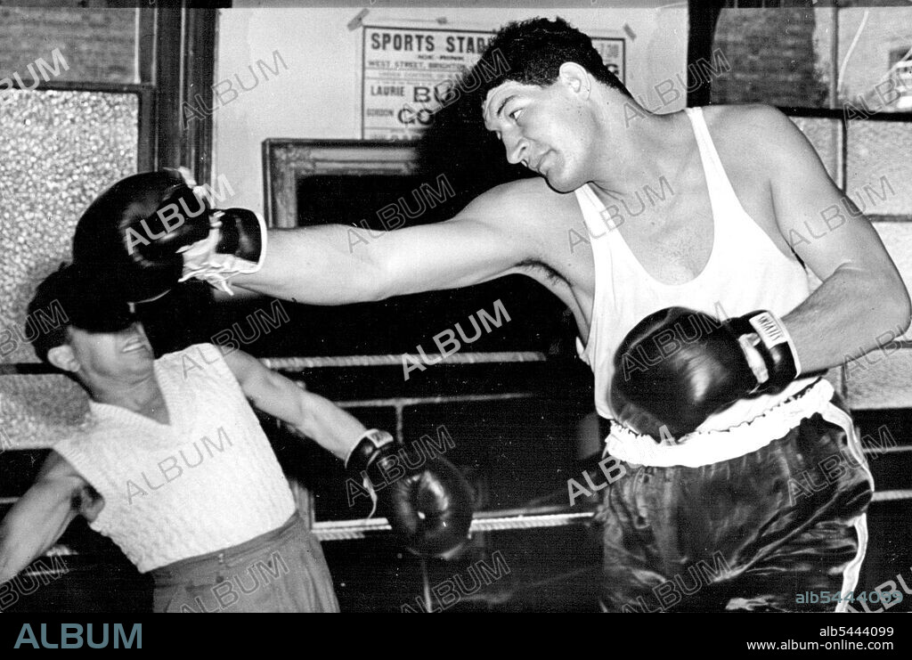 Giant South African Boxer To Have His First Contest In England. Ewart Potgieter in action during training. Ewart Potgieter, the giant South African heavy weight boxer, is now finishing off his training in readiness for his contest against Simon Templar at the White City Stadium, London. September 12, 1955. (Photo by Sports and General Press Agency Limited).