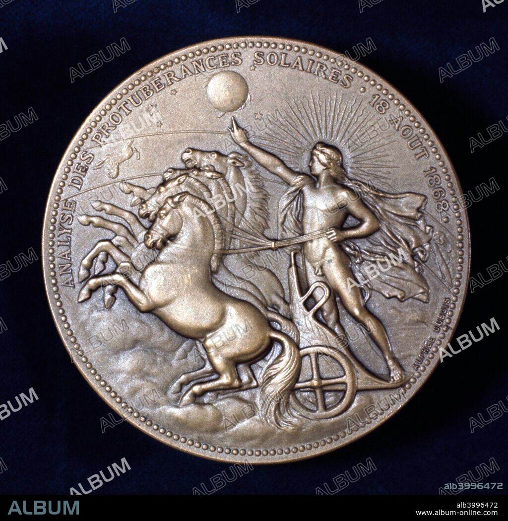 Medal commemorating Pierre Janssen and Joseph Norman Lockyer, French and English astronomers, 1868. In 1868, working independently of each other on spectroscopic studies of solar prominences, Pierre Jules Cesar Janssen (1824-1907) and Joseph Norman Lockyer (1836-1920) both observed a yellow line in the solar spectrum. Lockyer named it Helium from helios (sun). Reverse of a commemorative medal showing Phaeton driving his father Apollo's chariot near the sun.