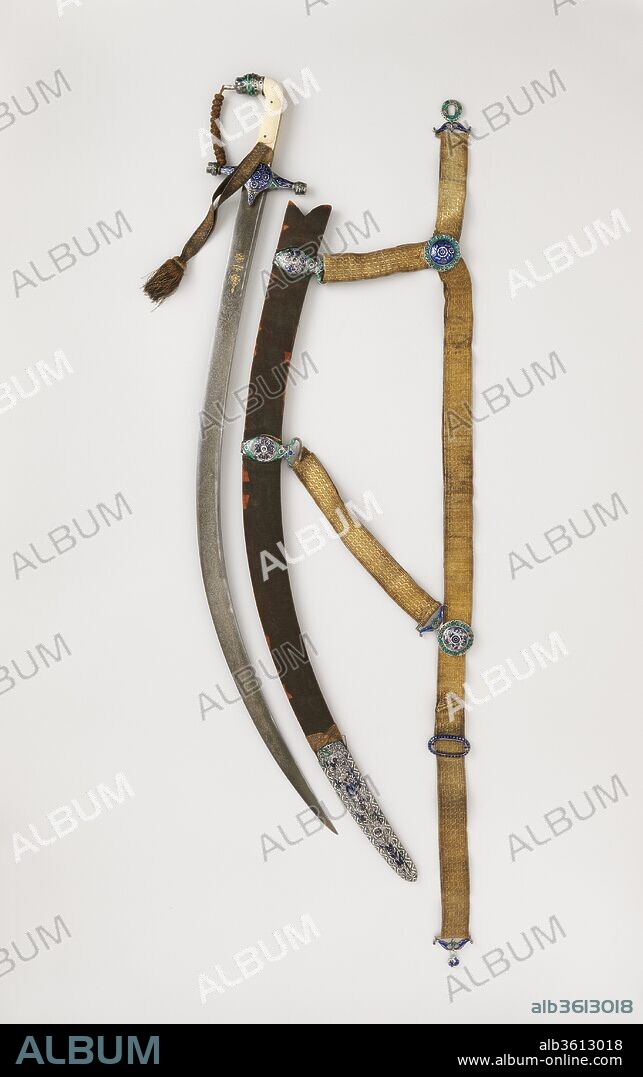 Sword (Shamshir) with Scabbard and Belt. Culture: hilt, scabbard, and belt, Indian; blade, northern India. Dimensions: L. 36 1/4 in. (92.2 cm); L. of blade 30 3/4 in. (78.1 cm); Wt. 2 lb. 4 oz. (1011 g); Wt. of scabbard 1 lb. 6 oz. (630 g). Date: hilt, scabbard, and belt, early 19th century; blade, A.H. 1162/A.D. 1748-49.
The hilt of this saber is mounted in enameled silver in a style associated with the north Indian city of Lucknow, in the Mughal province of Oudh. The blade of crucible ("watered") steel is exceptionally rare, as it includes the name of the maker, Baqir Mashhadi, an Iranian swordsmith active in India, his patron, Safdar Jang Bahadur, an Iranian who ruled as nawab (governor) of Oudh from 1739 to 1754, and the date of its manufacture.