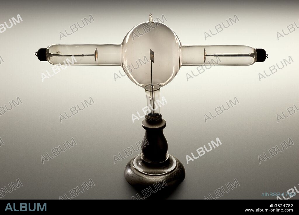 Double focus x-ray tube, Europe, 1896. This tube worked by using an alternating current, which accelerates electrons towards an aluminium plate. This produced x-rays at both ends of the tube. Wilhelm Roentgen, a German physician, took the first x-ray in 1896 of his wife's left hand. Dense areas of bone show up as white whilst soft tissue allow the x-ray to pass through undeterred. Very quickly x-rays proved their usefulness as a diagnostic and therapeutic tool in medicine. Within six months of Roentgen's announcement, x-rays were being used by battlefield physicians to locate bullets in wounded soldiers. X-rays allowed physicians their first look inside the body without resorting to surgery.