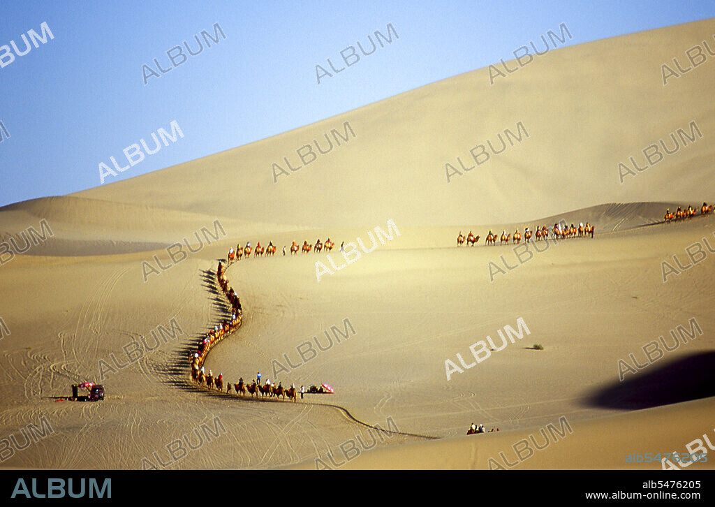 Mingsha Shan (Singing Sand Dunes) are situated about 4km south of Dunhuang. They are the largest and most impressive sand dunes in China. The main dunes rise to between 250m and 300m. They are called ‘Singing Sands’ because the shifting grains of sand make a humming noise in powerful winds. The Kumtagh Desert is a section of the Taklamakan Desert which lies east-southeast of the Desert of Lop.