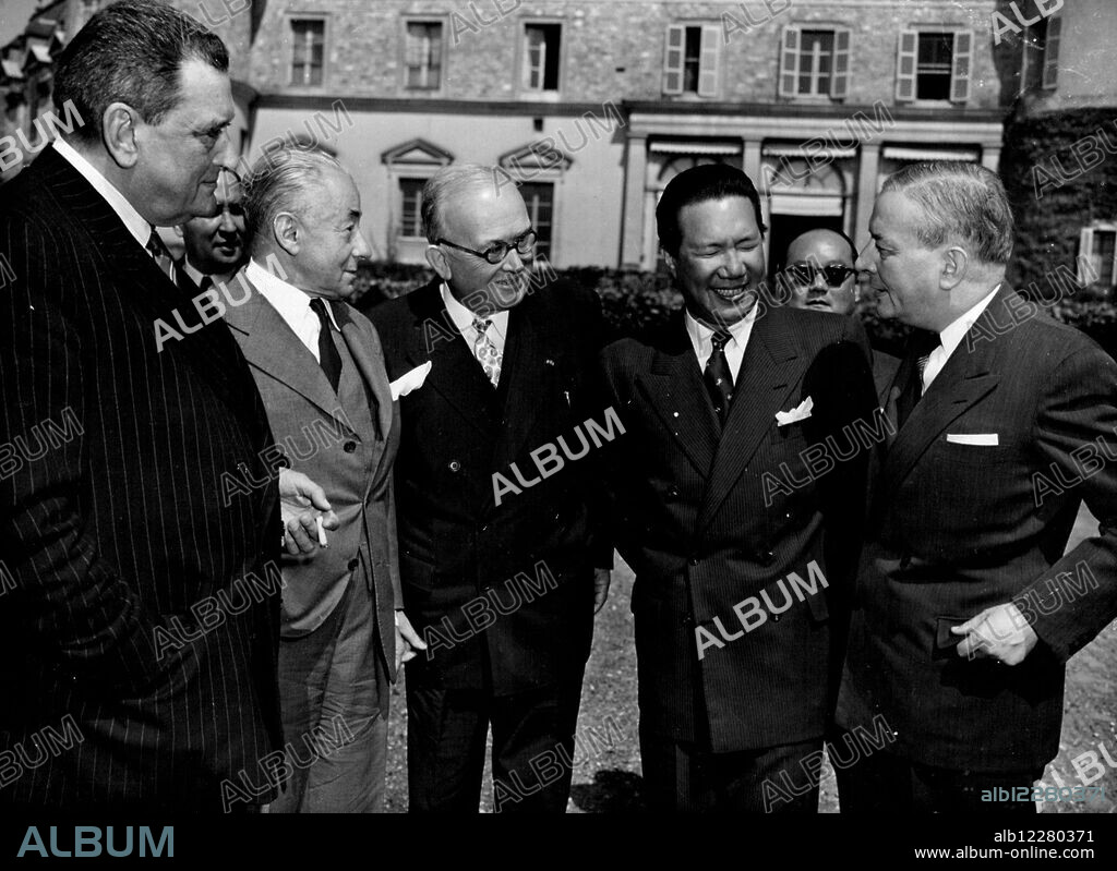 Bao-Dai at Rambouillet -- Emperor Bao-Dai  (Second From Right), is photograped in the grounds of Rambouillet Castle, the summer residence of the French President, after his conversations with the French Government there, August 28th Left to Right: are Premier Joseph Laniel: Paul Reynaud, Vice-Premier; President Vincent Auriol; Bao-Dai and Georges Bidault, foreign Minister.The conversations ended with Reaffirmations by the French of their intention of Granting full independence to Vietnam, and by the Emperor of the free association of Vietnam in the French Union. September 06, 1953. (Photo by Associated Press Photo).