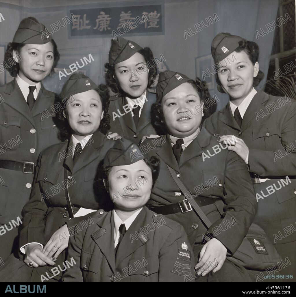 Group Portrait of a unit of Chinese American Women who served in the American Women's Voluntary Services, Back row, Mrs. Florence Wong, Mrs. Helen Chan, Mrs. Lily Chu; center: Mrs. Elizabeth Ong, Mrs. Bik Lee; front: Mrs. Josephine Hong, chairman of all the AWVS Chinese unit, Al Revenna, World Telegram & Sun Collection, 1942.