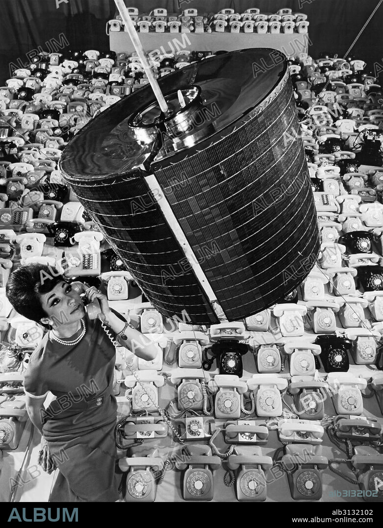 Los Angeles, California: April, 1965 A Hughes Aircraft Company employee uses one of the 480 telephones that the Intelsat 1 'Early Bird' communications satellite can transmit in two way telephone conversations between Europe and North America.