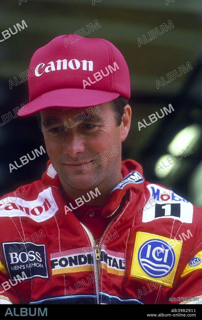 Nigel Mansell at the British Grand Prix, Silverstone, Northamptonshire, 1988. When he won the World Drivers' Championship in 1992, Nigel Mansell became the first British champion since James Hunt 16 years earlier. An immensely popular driver with British motor racing fans, Mansell won 31 Grands Prix in a career which began in 1980. He completely dominated his Championship-winning season, winning 9 of the 16 races, including all the first 5. The next season he left Formula 1 for Indycar racing in America, winning the Championship at his only attempt. After two unsuccessful flirtations with a return to Formula 1, Mansell retired from racing in 1995, returning to the sport for a season racing touring cars in 1998.