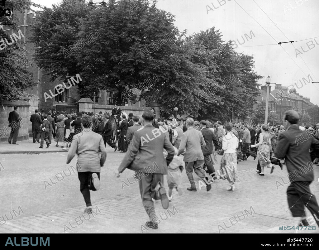 Ruth Ellis Is Hanged -- Crowds Rush across the road at Holloway Prison, London, This Morning July 13 to Read the official notice Saying Ruth Ellis had been Hanged. She was Executed for the Murder of her Lover, David Blakely, a racing motorist, and was the 14th Woman hanged in Britain This Century. Mounted Police were needed to keep the crowds in order outside the Gaol. July 21, 1955. (Photo by Associated Press Photo).
