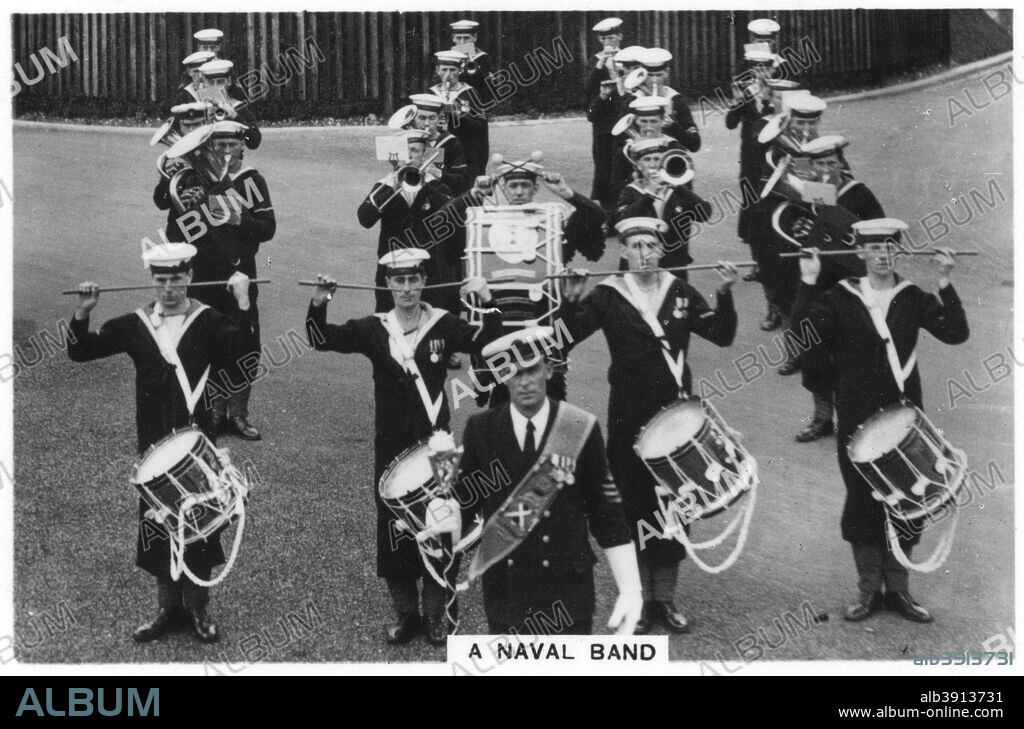 A naval band of HMS 'Vernon' shore establishment at Portsmouth, 1937. Cigarette card from The Navy series, produced by Senior Service Cigarettes, 1937.