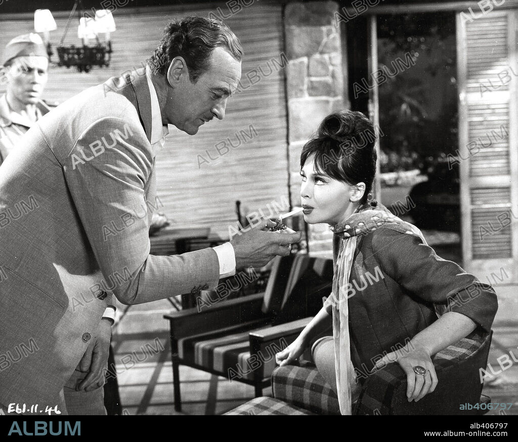DAVID NIVEN and LESLIE CARON in GUNS OF DARKNESS, 1962, directed by ANTHONY ASQUITH. Copyright WARNER BROTHERS.