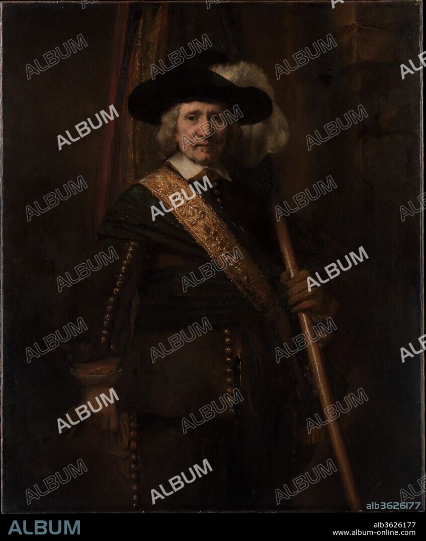 The Standard Bearer (Floris Soop, 1604-1657). Artist: Rembrandt (Rembrandt van Rijn) (Dutch, Leiden 1606-1669 Amsterdam). Dimensions: 55 1/4 x 45 1/4in. (140.3 x 114.9cm). Date: 1654.
The flag, the plume in the hat, and the tooled leather baldric (sword-belt) indicate that the figure is an ensign in one of Amsterdam's civic guard companies. He is almost certainly Floris Soop, a wealthy bachelor whose estate included 140 paintings. Rembrandt conveys a strong sense of character and reveals extraordinary skill in the vigorously modeled face, the thick hair, and costume details. The impressions of volume in the figure and space in the background have been diminished by abrasion and darkening with age.