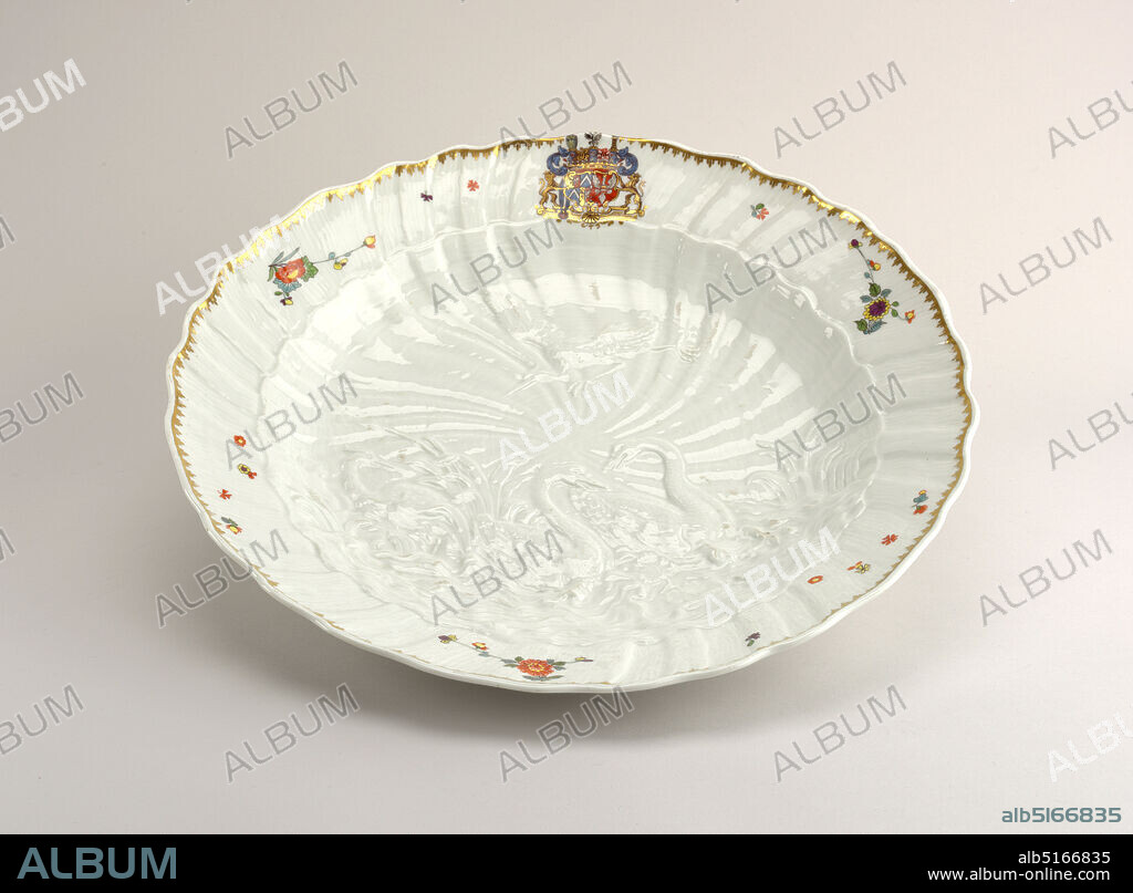 Charger, from the Swan Service ('Schwanenservice'), Meissen Porcelain Manufactory, German, active from 1710 to the present, Heinrich Graf von Brühl, German, 1700 - 1763, hard paste porcelain, vitreous enamel, gold, Molded with two swans swimming in rough water among fish and shells and flanked by bulrushes, a heron wading with a fish in its beak another in flight above, on a spiral shell-mounted ground. Decorated with a gilt rim and a large coat-of-armor at the top beneath border., Germany, ca. 1738, ceramics, Decorative Arts, charger, charger.