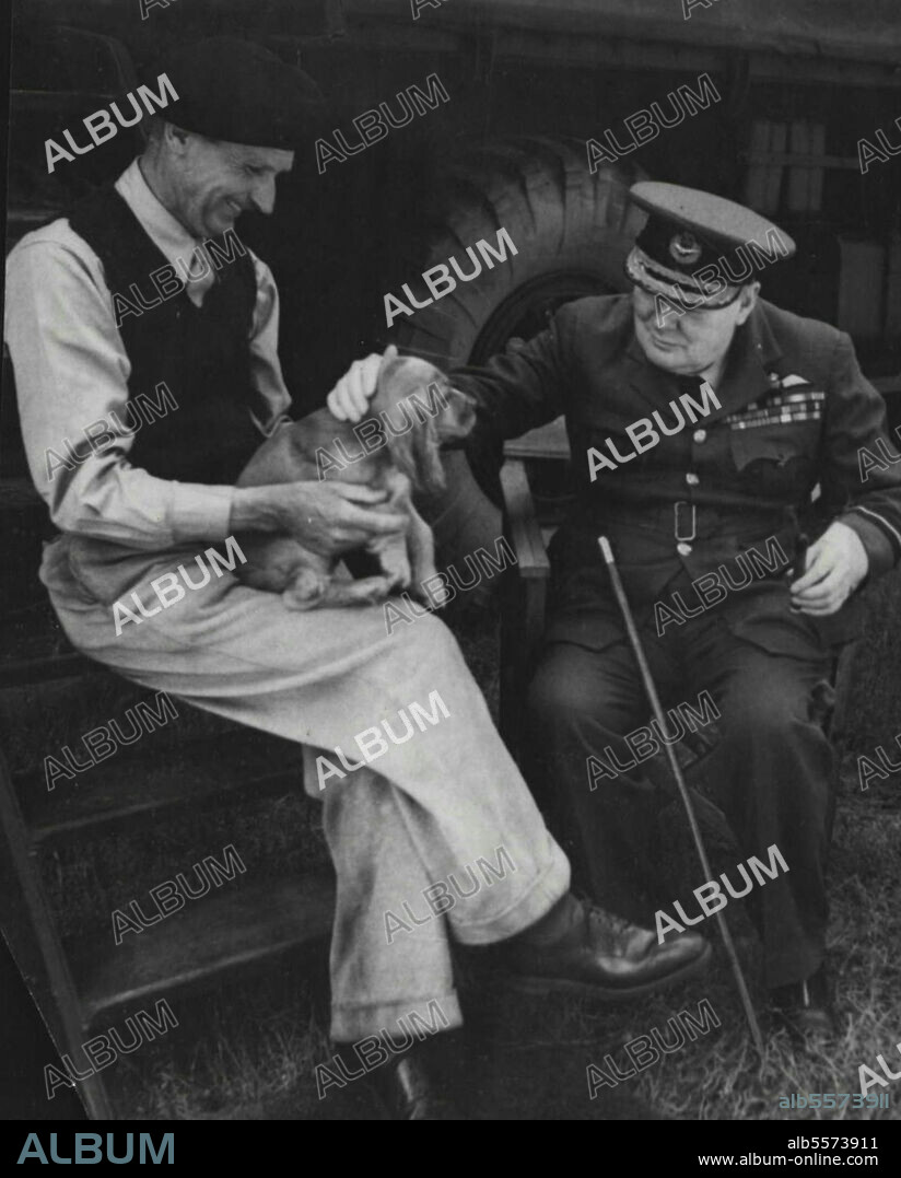 Prime Minister In Normandy Again *****: General Montgomery introduces one of the his puppies "Rommel" to the Prime Minister. Mr. Winston Churchill has made a flying ***** to Normandy to receive first hand ***** of our recent advances from General Montgomery and General Bradley. August 07, 1944.