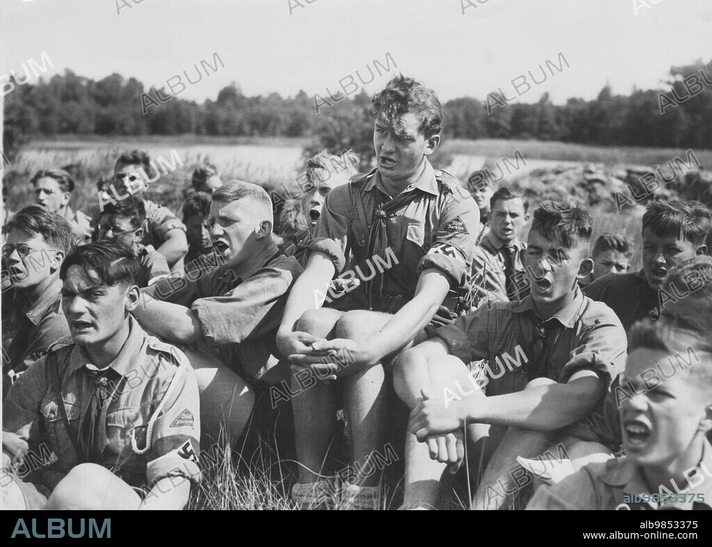 Members of the Hitler Youth sing in the Germany camp near Kuhlmühl in Mecklenburg. [automated translation].