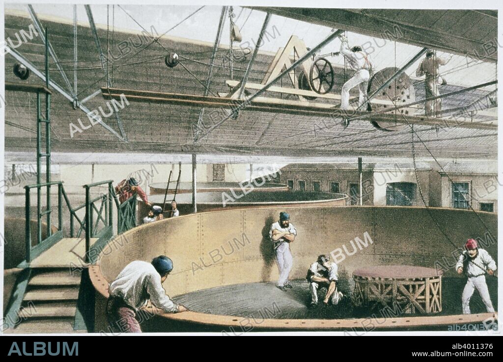 Manufacturing the transatlantic telegraph cable, c1865 (1866). Coiling the telegraph cable in the tanks at the works in Greenwich. The cable, connecting Valentia island, off the Irish coast, and Trinity Bay, Newfoundland, was successfully laid in the summer of 1866 by Brunel's steamship, the 'Great Eastern'. From The Atlantic Telegraph by William Howard Russell, published 1866.