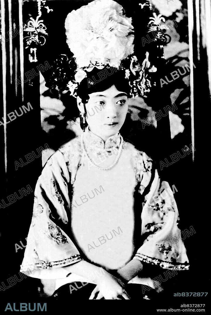 Gobulo Wan Rong ('Beautiful Countenance') was the daughter of Rong Yuan, the Minister of Domestic Affairs of the Qing Government and head of one of Manchuria's most prominent, richest families. At the age of 17, Wan Rong was selected from a series of photographs presented to the Xuan Tong Emperor (Puyi). The wedding took place when Puyi reached the age of 16.<br/><br/>. Wan Rong was the last Empress Consort of the Qing Dynasty in China, and later Empress of Manchukuo (also known as the Manchurian Empire). Empress Wan Rong died of malnutrition and opium addiction in prison in Jilin.<br/><br/>.