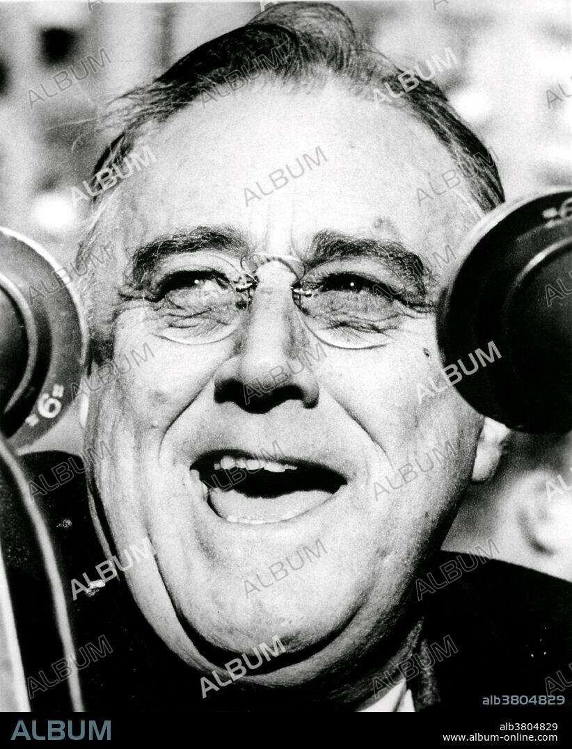 Franklin Delano Roosevelt (January 30, 1882 - April 12, 1945) was the 32nd President of the US (1933-45) and a central figure in world events during the mid-20th century, leading the US during a time of worldwide economic crisis and world war. The only American president elected to more than two terms, he facilitated a durable coalition that realigned American politics for decades. With the popular song "Happy Days Are Here Again" as his campaign theme, FDR defeated incumbent Republican Hoover in 1932, at the depth of the Great Depression. FDR's persistent optimism and activism contributed to a renewal of the national spirit, reflecting his victory over paralytic illness to become the longest serving president in US history. As an active military leader, he implemented a war strategy on two fronts that ended in the defeat of the Axis Powers, and he initiated the development of the world's first atomic bomb. He worked closely with Churchill, Stalin and Kai-shek in leading the Allies against Nazi Germany, Fascist Italy and Imperial Japan in WWII, but died just as victory was in sight. On April 12, 1945 he suffered a massive cerebral hemorrhage and died at the age of 63. His death was met with shock and grief across America and around the world.