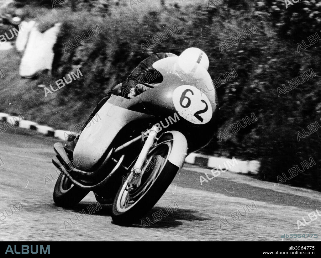 John Surtees racing an MV Agusta, 1958. He won the Junior and Senior Isle of Man TT races in this year, as well as winning the 500cc world championship for MV. He was the only man to ever win a World Drivers? Championship on two and four wheels. He competed in 15 TT races and finished in all except the 1956 Junior. At the end of the 1960 season, he decided to finish his motorcycling career and turned to four wheels, going on to win the F1 World Drivers Championship.