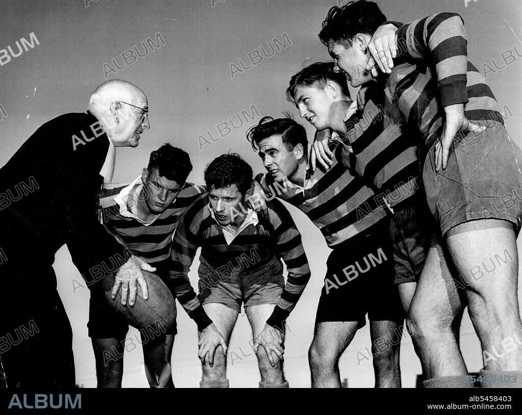 L to R: Brother Henry, Tom Smith, Terry Brain, John Maunders and John Wald. Brother Henry, a Rugby union coach at St. Joseph's College, Hunter's Hill, from 1910 to 1954 died yesterday aged 93. Born Francis Gaffney in Cardiff, in 1877, he came to Australia with his widowed mother in '1904 and settled in Brisbane. After leaving school he was one of the most spectacular half-backs of his time and was on the verge of representative honours. He came to Sydney, where he was ordained as a priest in 1906 after entering the Order of the Marist Brothers. In 1910 he coached the youngest boys of St Joseph's and went on to be-come the best-known Union coach in Sydney. July 13, 1951.