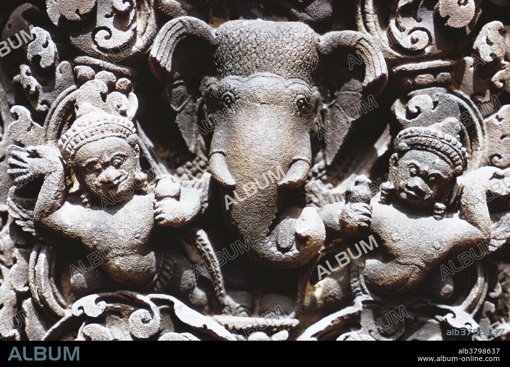Carving from Banteay Srei temple, a 10th century Cambodian temple dedicated to the Hindu god Shiva, located in the area of Angkor. Banteay Srei is built largely of red sandstone, a medium that lends itself to the sort of elaborate wall carving pictured here.