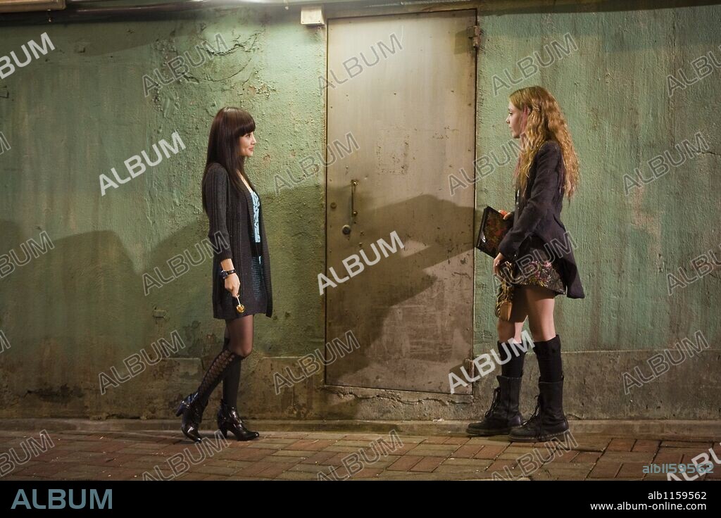 DAKOTA FANNING and XIAO LU in PUSH, 2009, directed by PAUL MCGUIGAN. Copyright INFINITY FEATURES ENTERTAINMENT/ICON PRODUCTIONS.