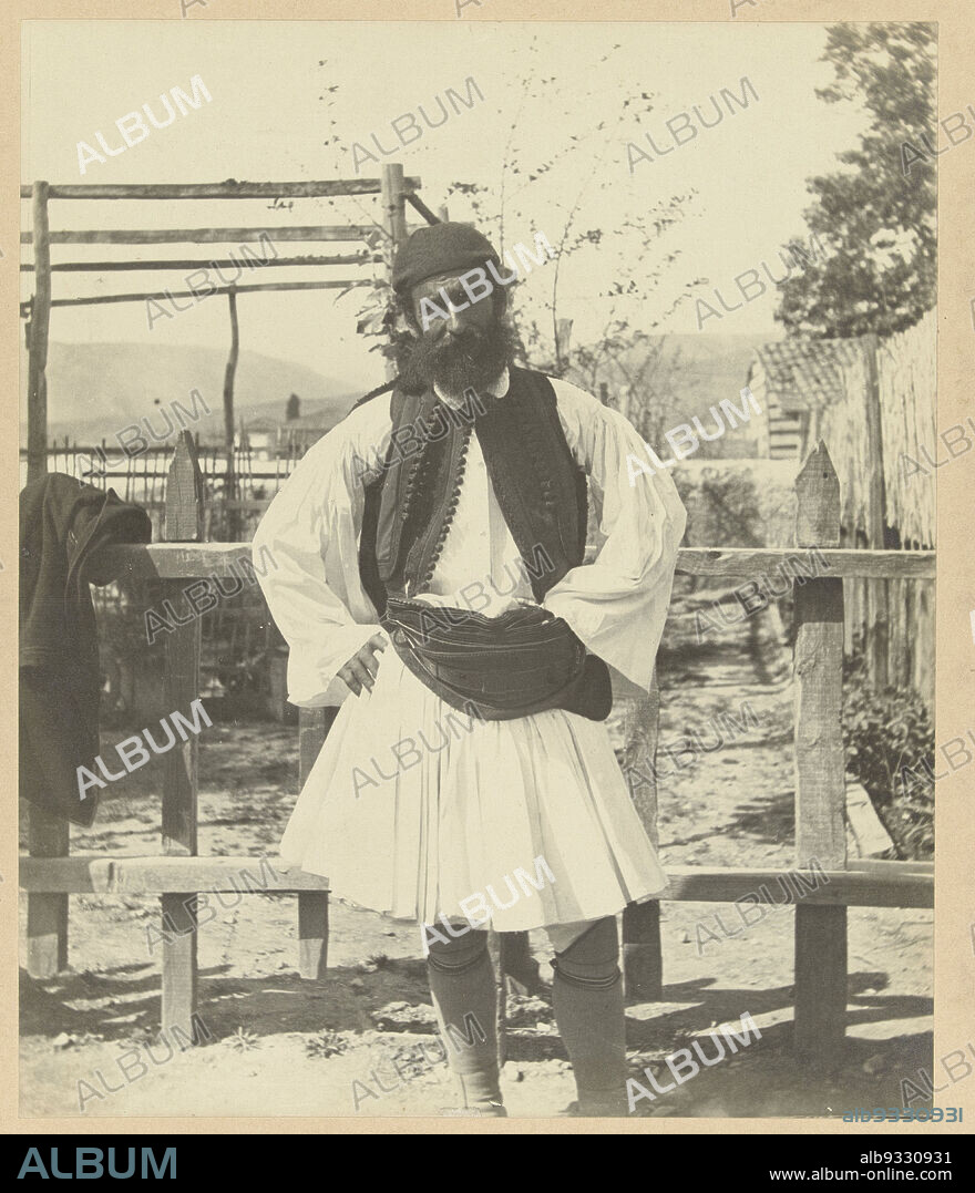 Greek farmer from Nauplia (title on object), Greece (series title), Portrait of a man in traditional Greek dress, Foustanela . The photograph is part of the series of photographs of Greece collected by Richard Polak., Mr. L. de Bruyn (attributed to), Athene, Netherlands, c. 1895 - c. 1915, photographic support, paper, gelatin silver print, height 300 mm × width 249 mmheight 467 mm × width 556 mm.